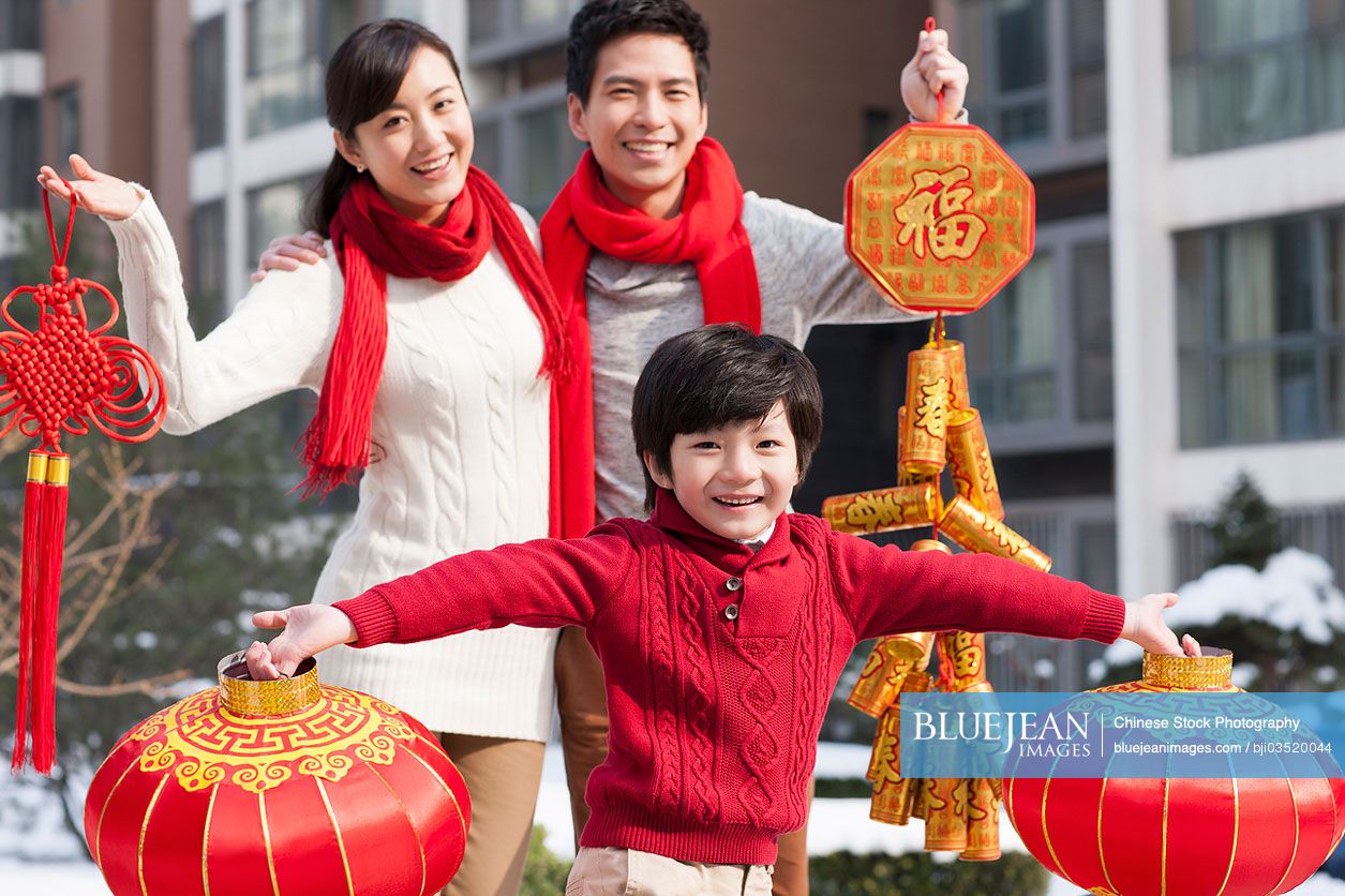 Cheerful Chinese family celebrating new year