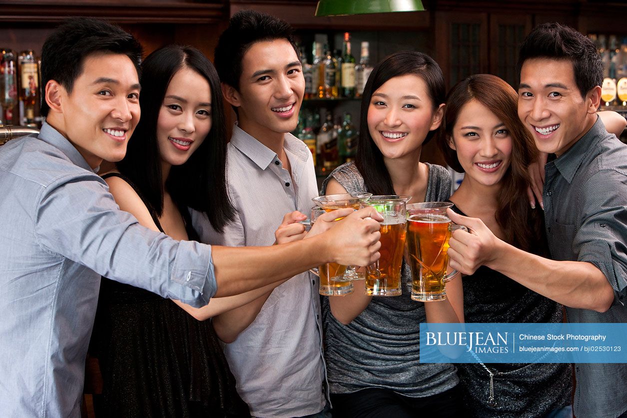 Chinese friends relaxing at a bar