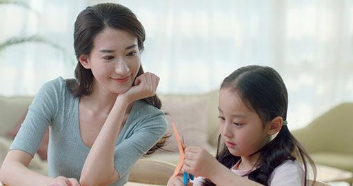 Happy Chinese mother and daughter making cards at home,4K