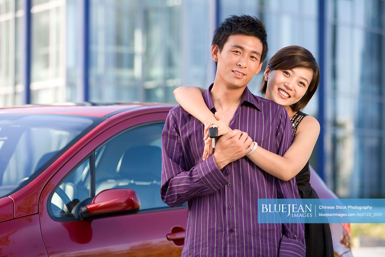 Young Chinese couple buys a new car