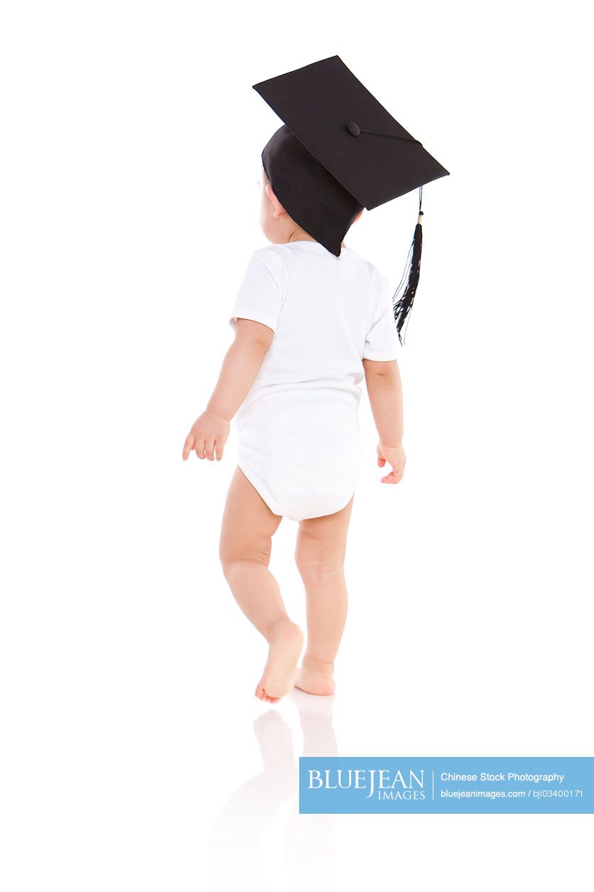 Happy Chinese baby boy with mortar board