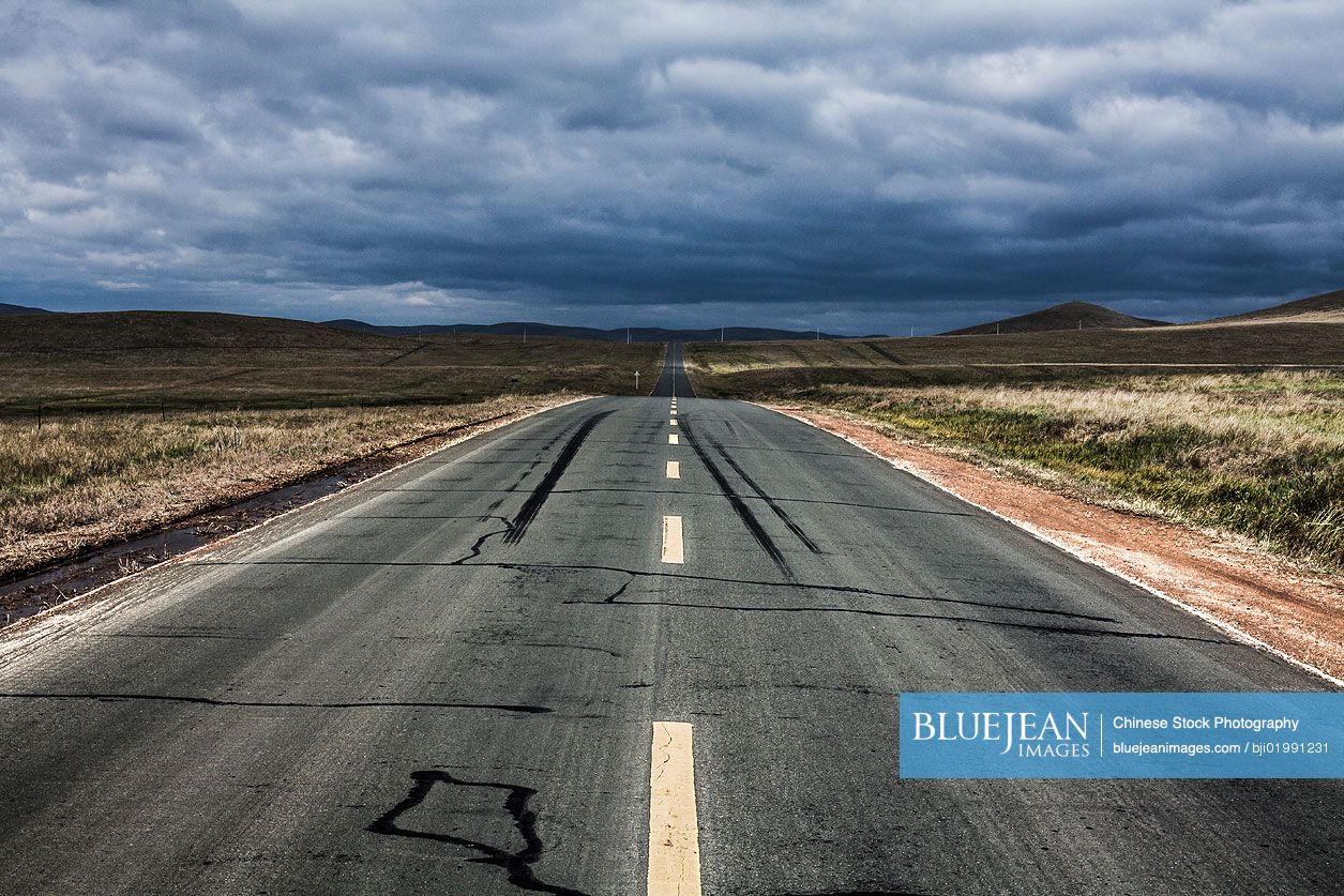 Road going through wilderness area in Inner Mongolia province, China