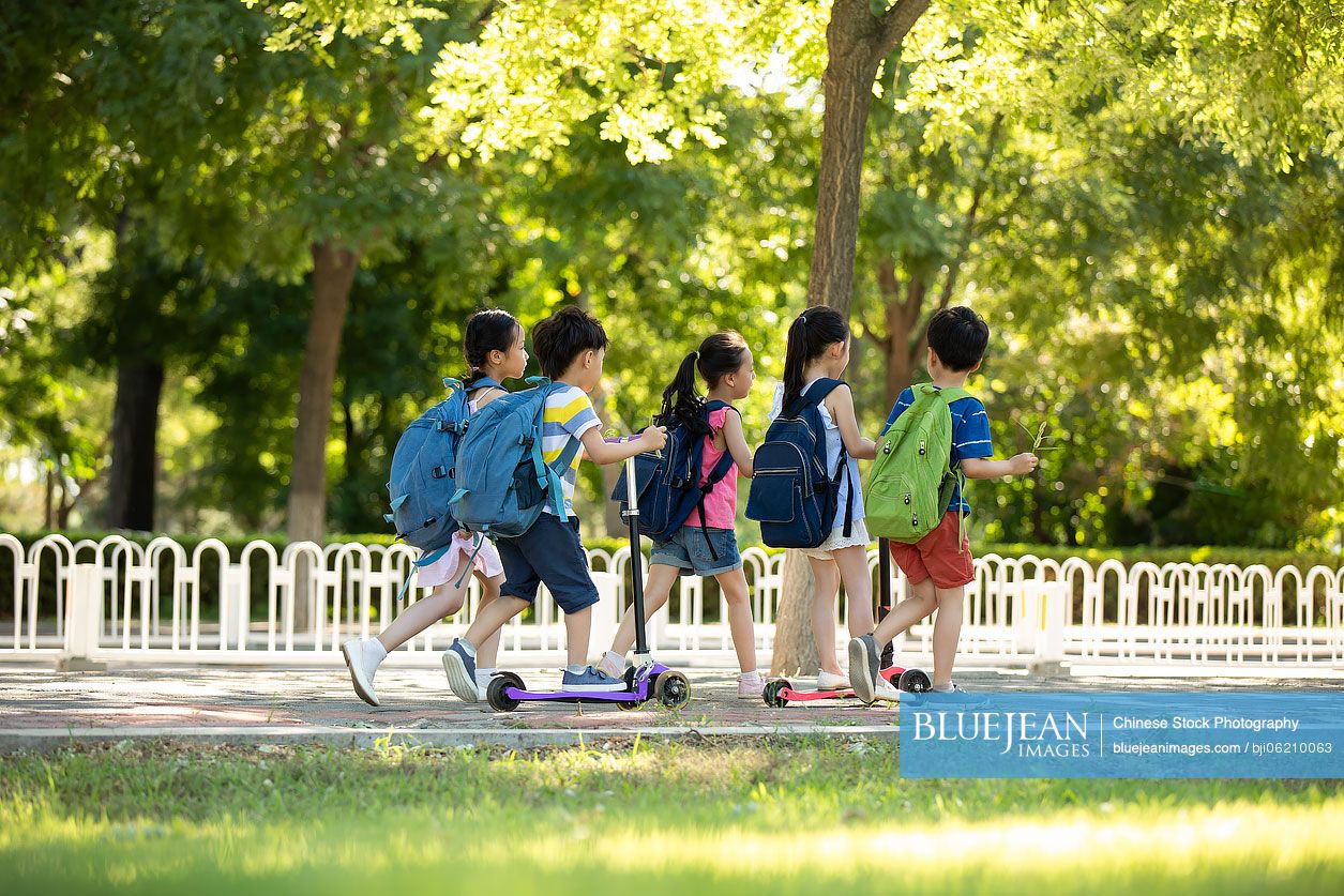Happy Chinese children going to school