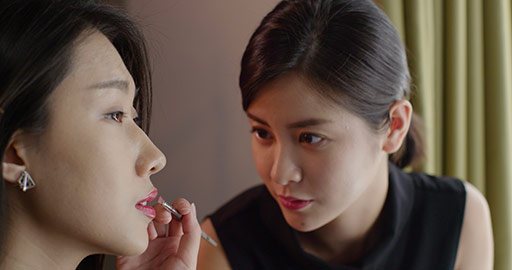 Chinese makeup artist applying makeup on model,4K