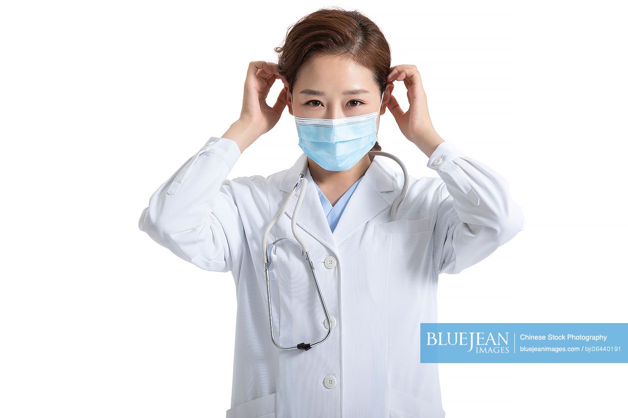 Young Chinese doctor wearing surgical mask