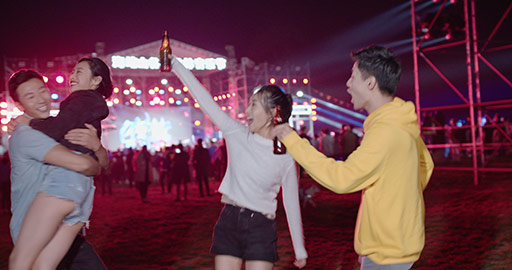 Happy young Chinese friends having fun at music festival,4K