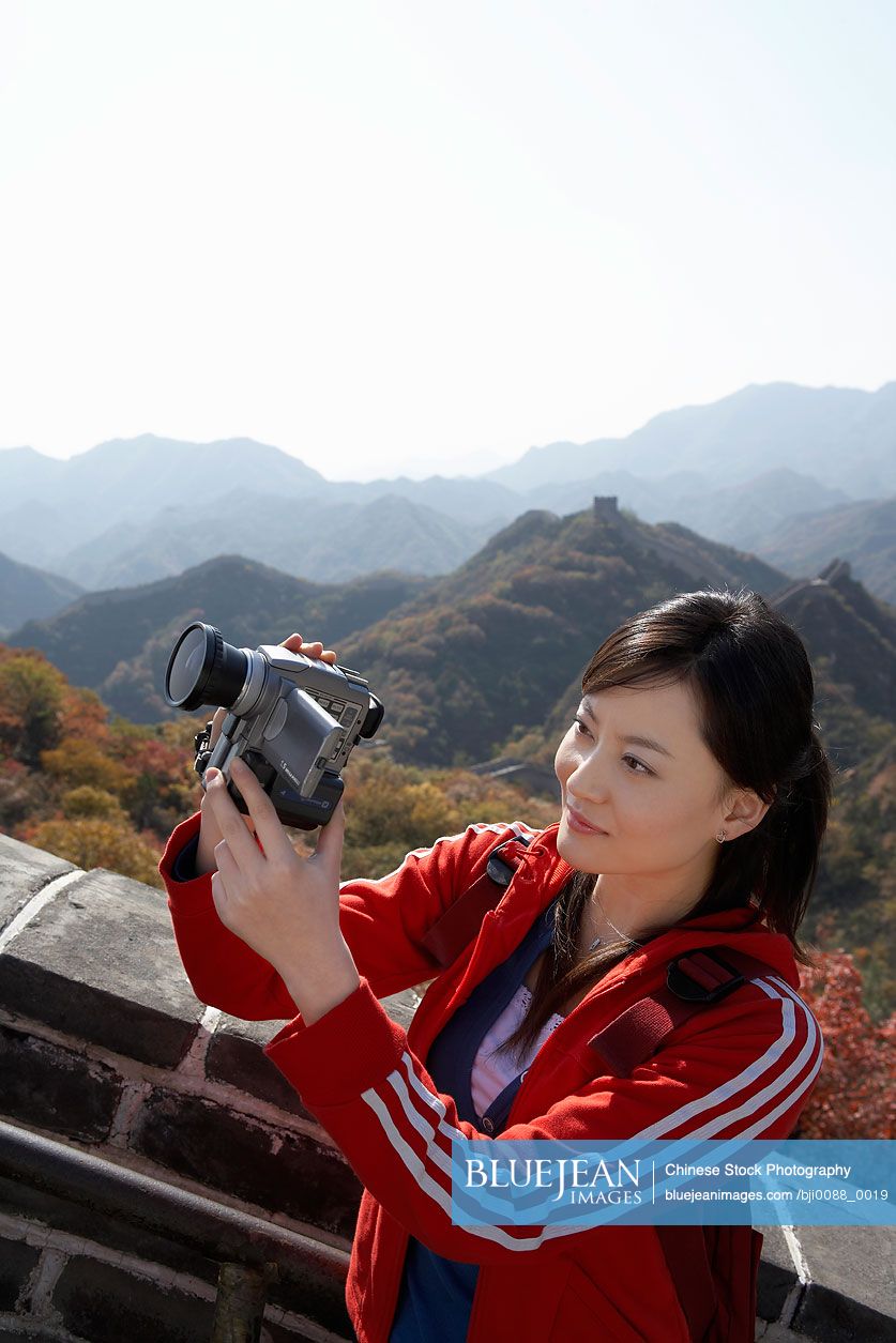 Chinese tourist filming the Great Wall of China