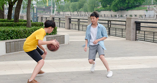 Chinese boys playing basketball outdoors,4K