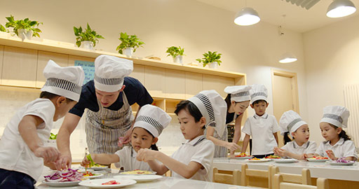 Children learning cooking in kindergarten classroom,4K