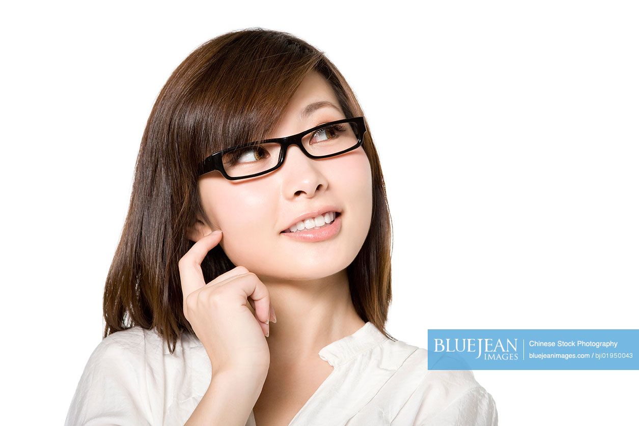 Portrait of young Chinese woman thinking