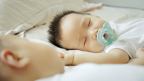 Two twin babies enjoying their midday nap