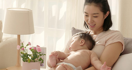 Young Chinese mom holding baby girl,4K