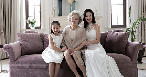 Happy Chinese family sitting on sofa,4K