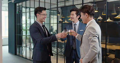 Successful Chinese businessmen drinking a toast in office,4K