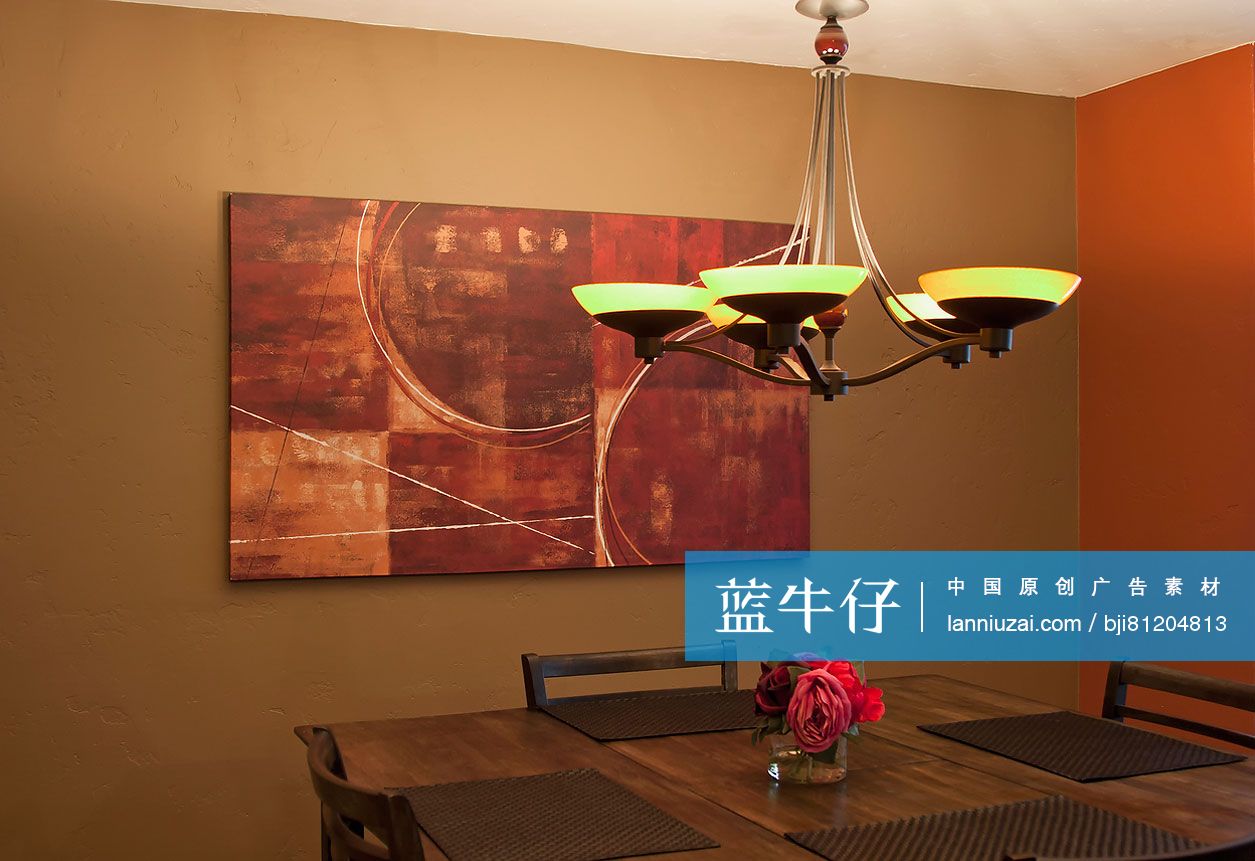 Chandelier and painting in dining area