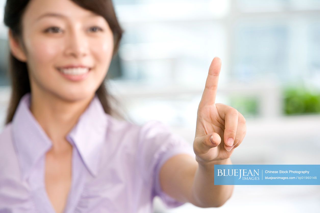 Chinese office worker pointing