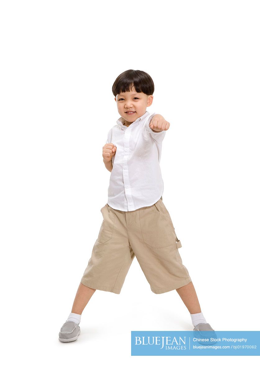 Little Chinese boy in a kungfu pose