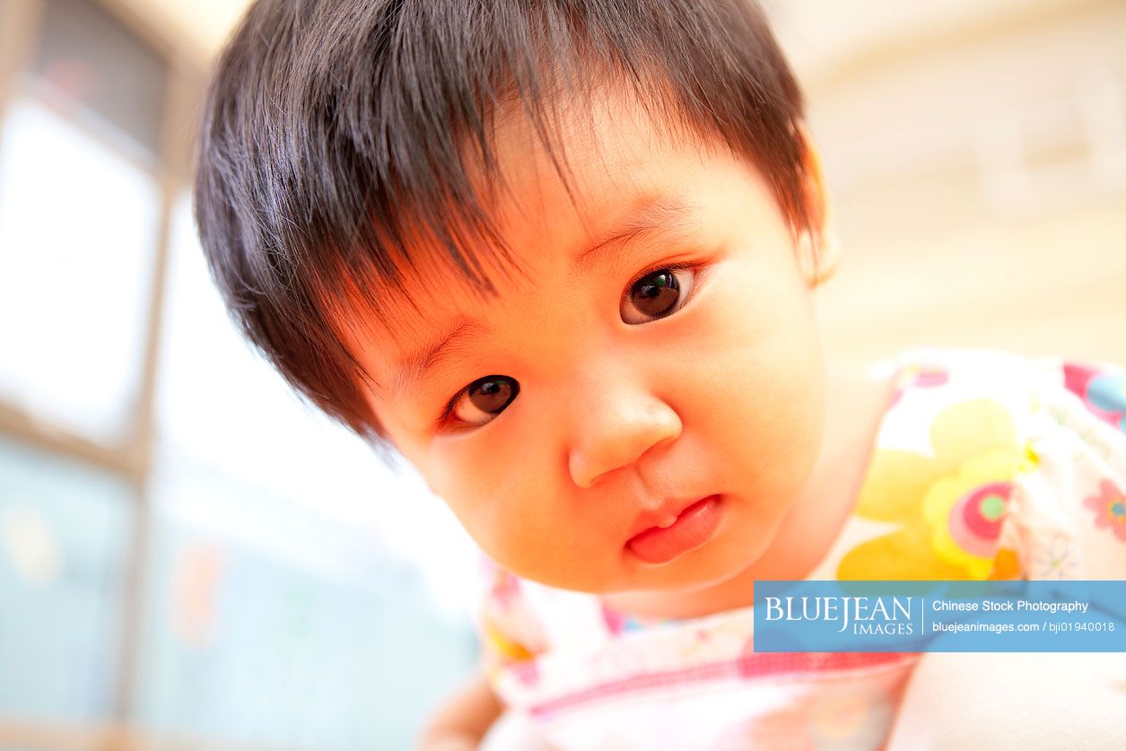 Chinese baby girl looking into camera