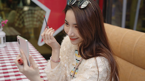Beautiful young Chinese woman applying lipstick,4K