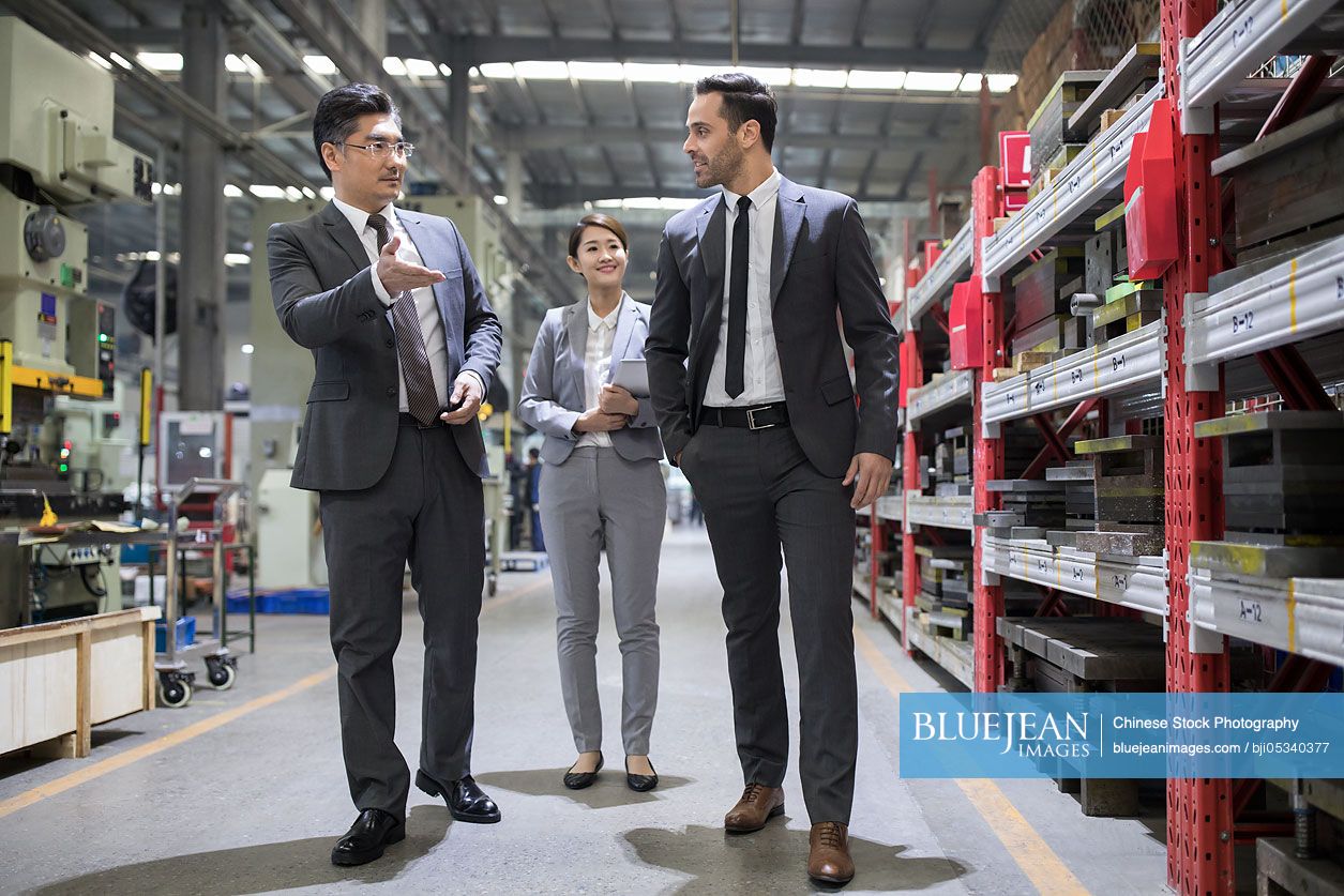Business people talking in the factory