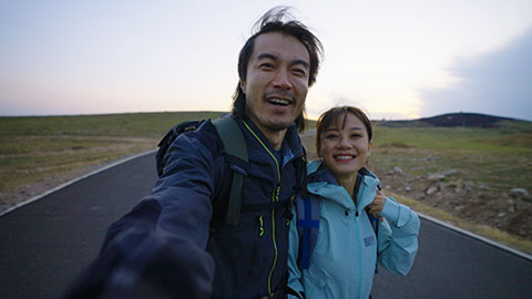Happy Chinese couple hiking outdoors,4K
