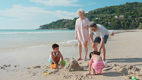 Happy Chinese family enjoying vacation on beach,4K