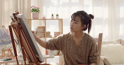 Young Chinese woman painting at home,4K