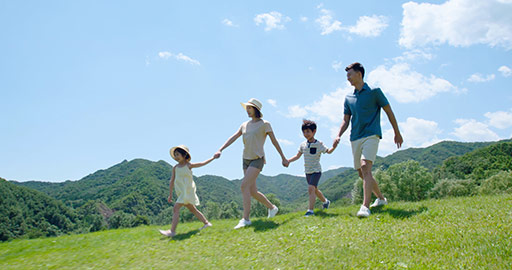 Happy young Chinese family walking outdoors,4K