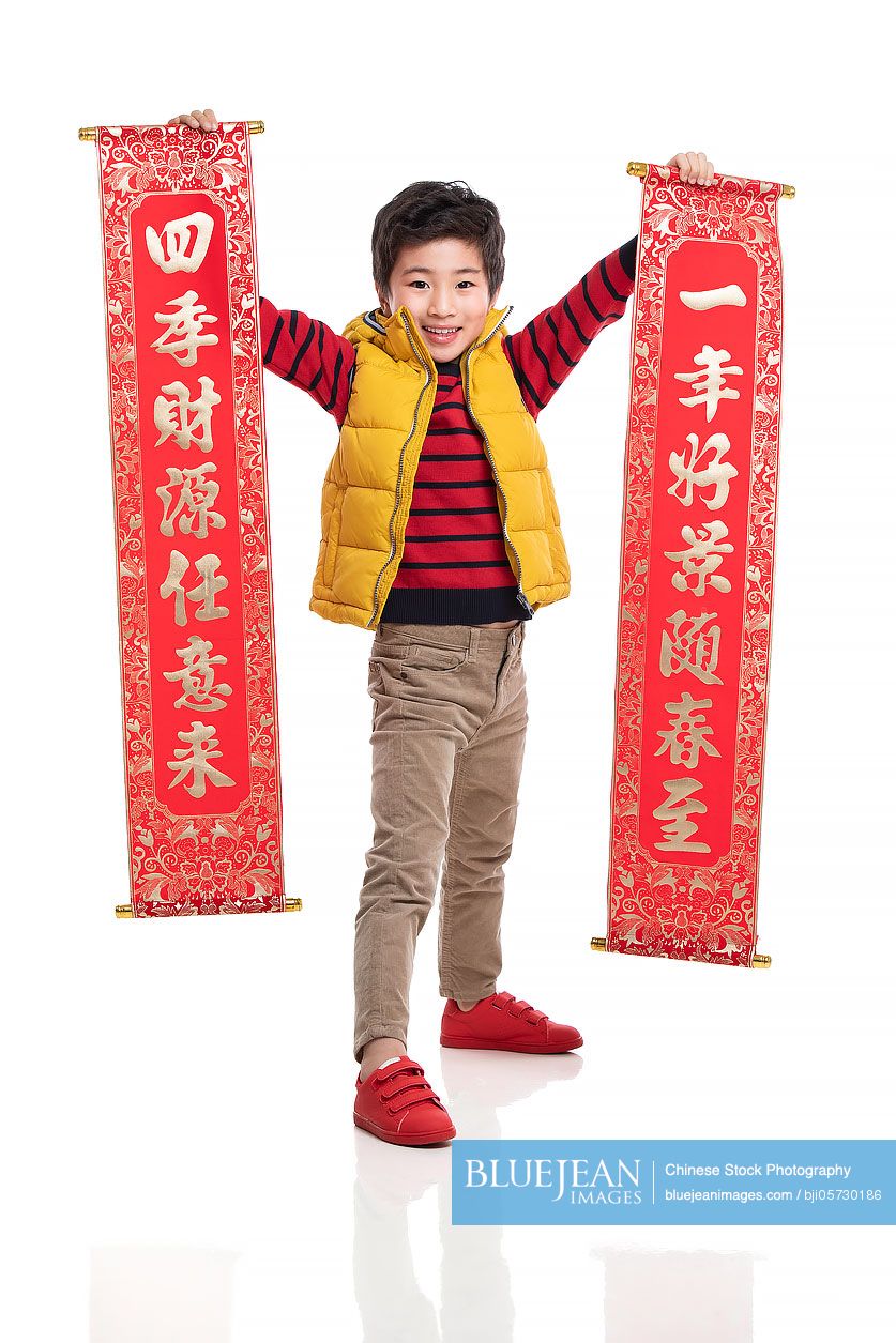 Happy little Chinese boy celebrating Chinese New Year