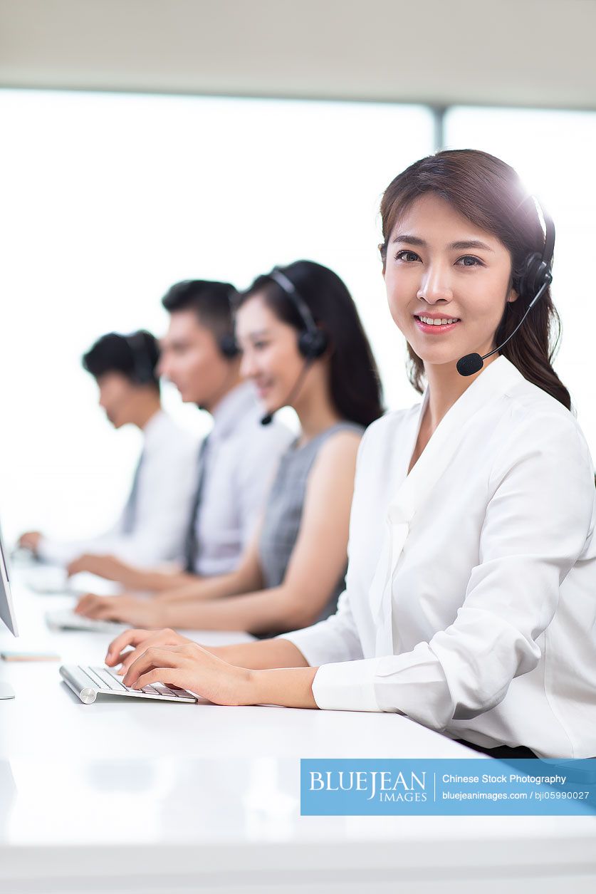 professional-chinese-customer-service-staff-in-office-high-res-stock