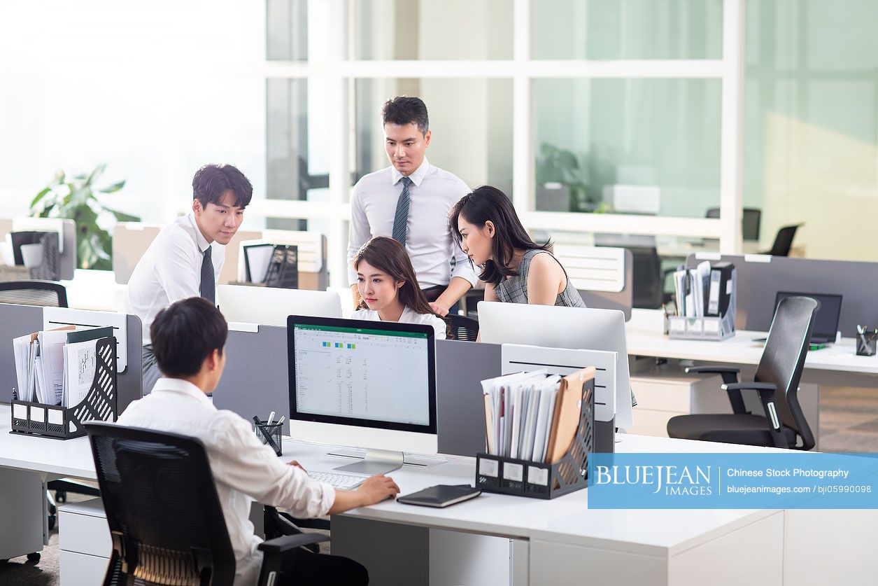 Chinese Business people using computer in office