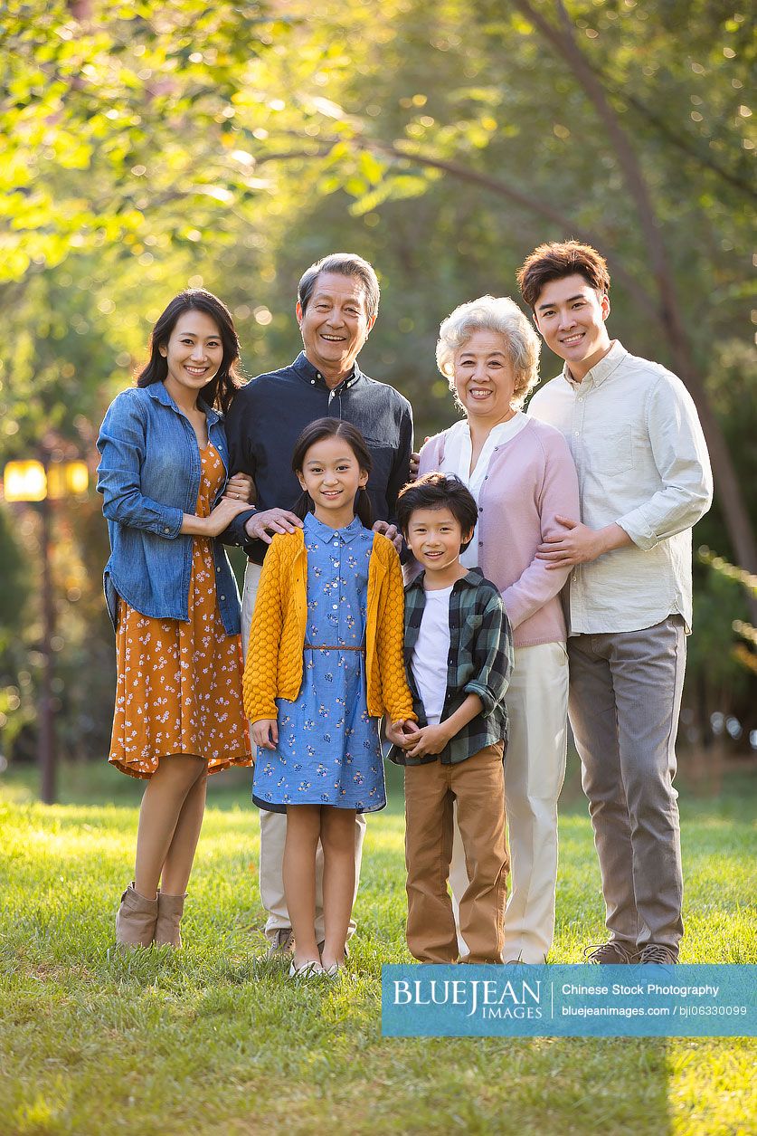 Happy Chinese family having fun in park