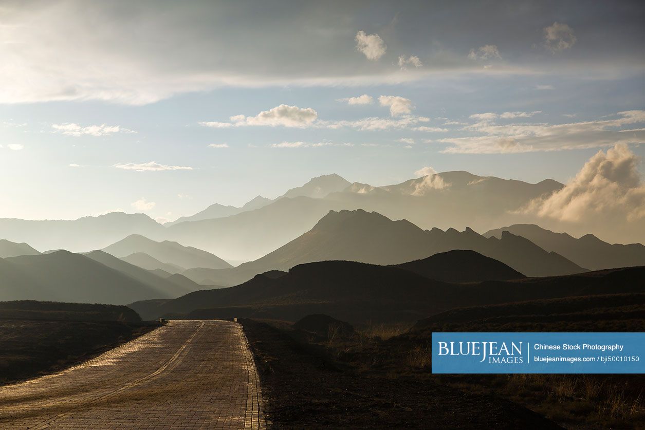 Road and mountain range in Gansu province, China