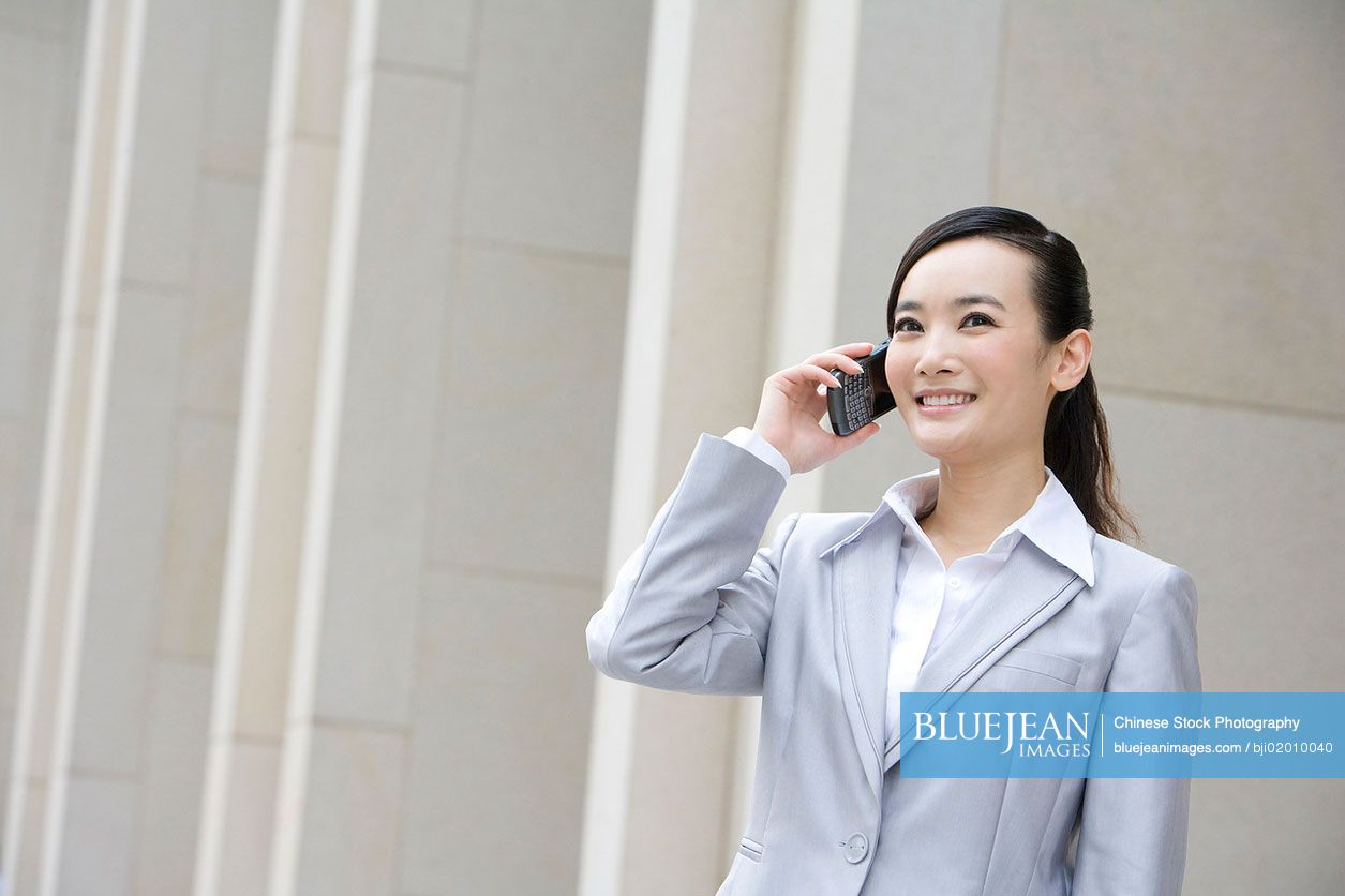 Portrait of Chinese businesswoman on the phone