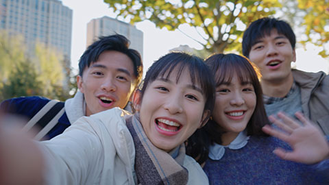 Happy Chinese college students video chatting