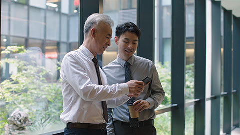 Confident Chinese business people talking in office building,4K