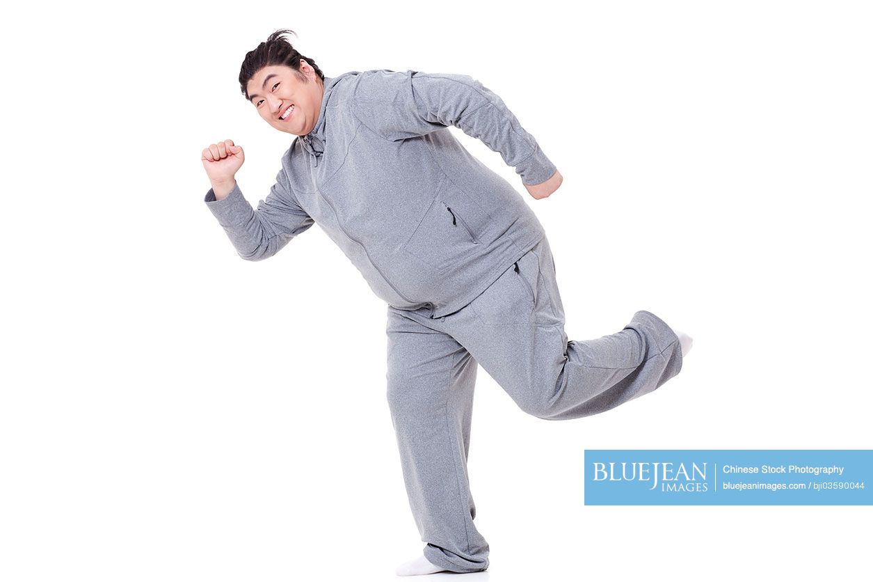 Funny Chubby Chinese man in running posture