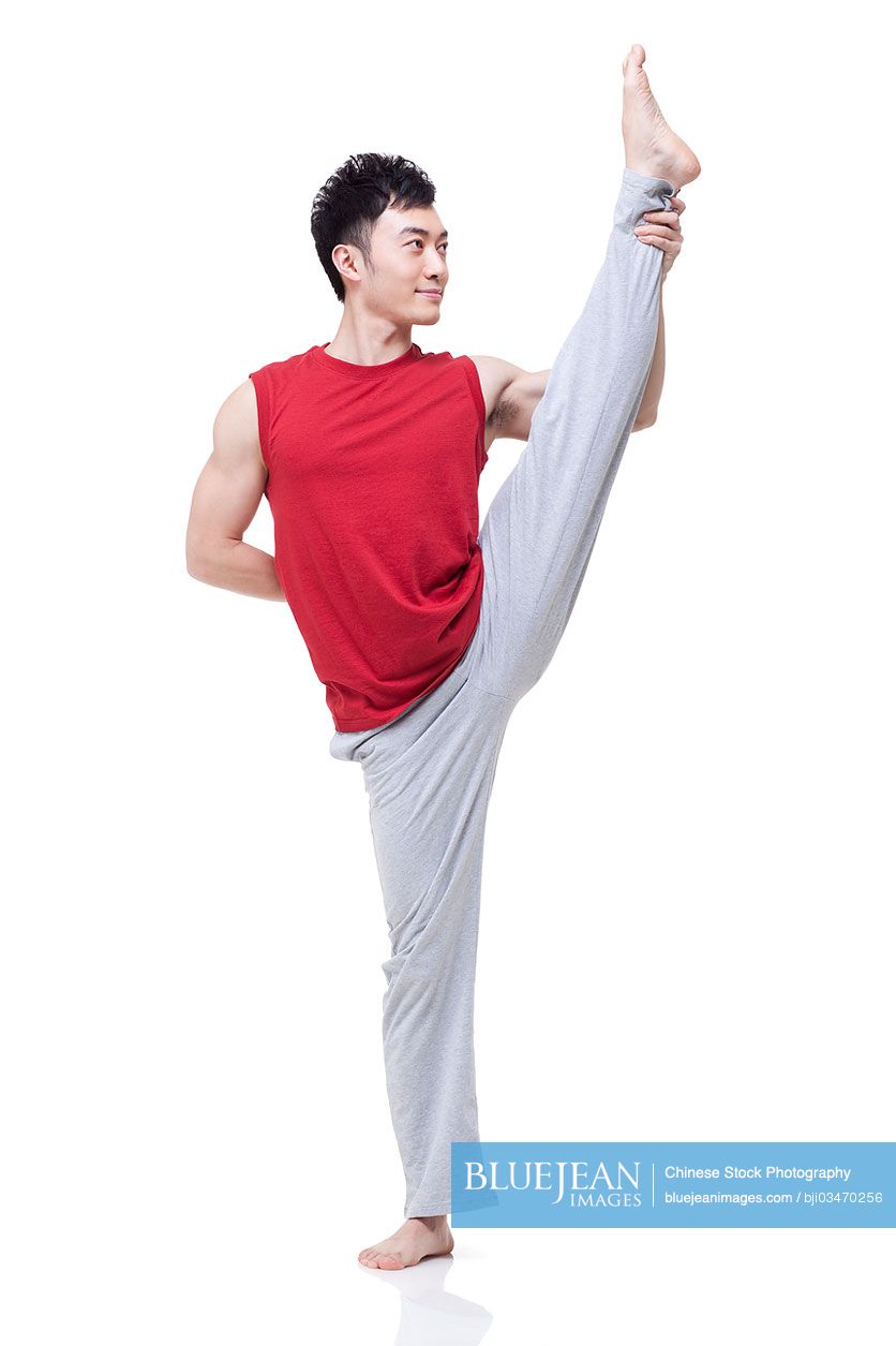 Young Chinese man doing yoga