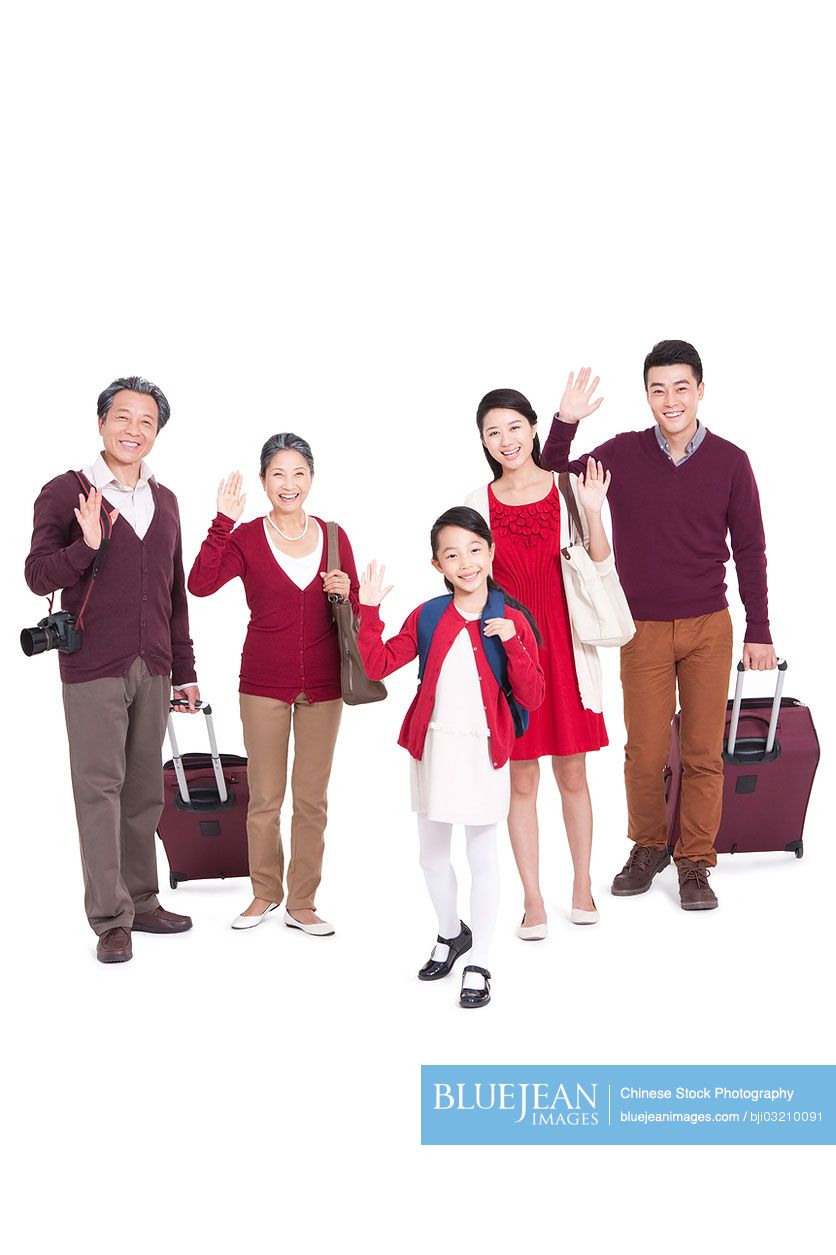 Joyful Chinese family going for a vacation