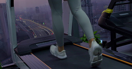 Young Chinese woman exercising on treadmill at gym,4K