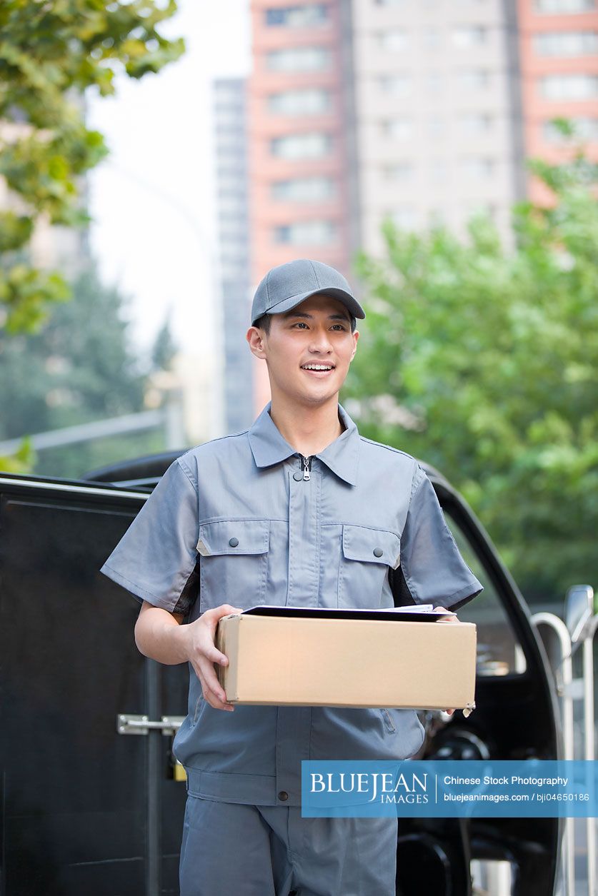 Chinese delivery person delivering package