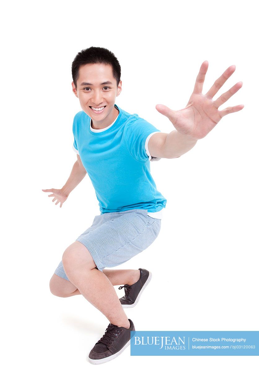 Excited young Chinese man gesturing