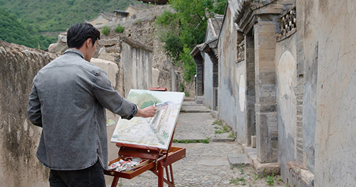 Young Chinese man painting outdoors,4K