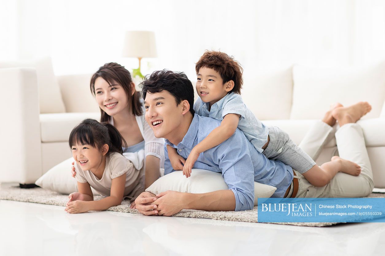 Happy family relaxing in living room