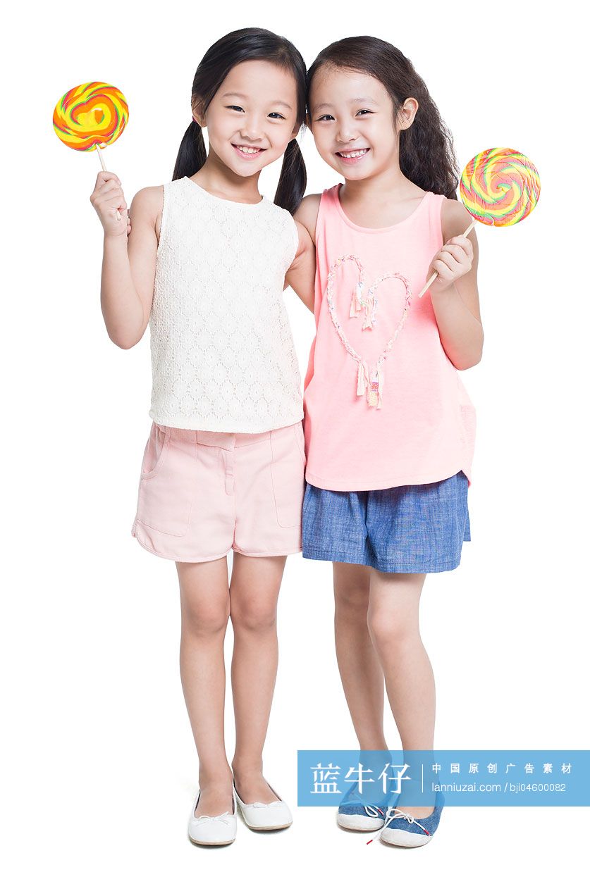快乐的女孩拿着棒棒糖