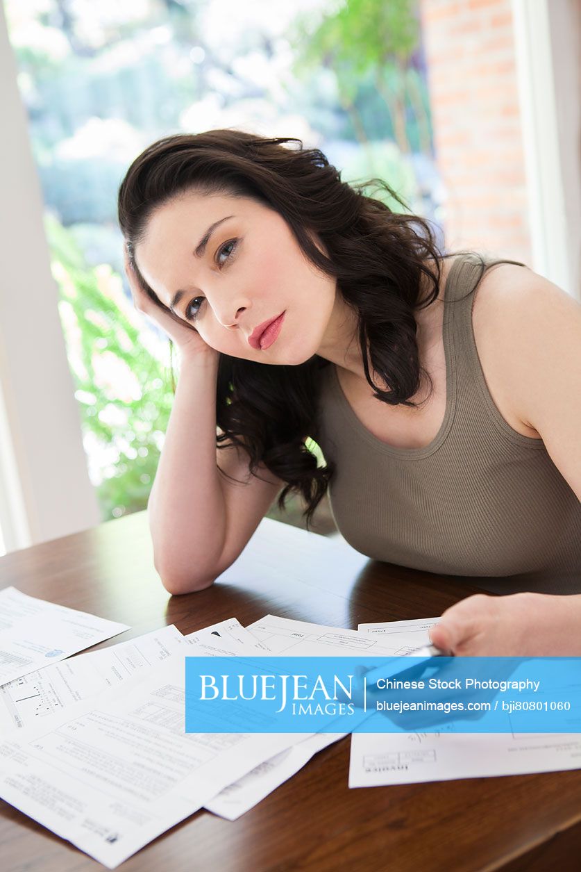 Mature woman doing home finance