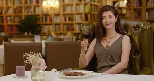 Beautiful Chinese woman drinking wine at restaurant,4K
