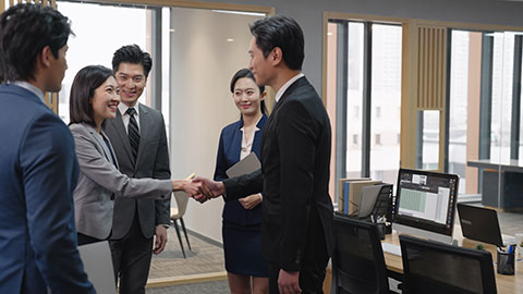 Successful Chinese business people shaking hands in office,4K