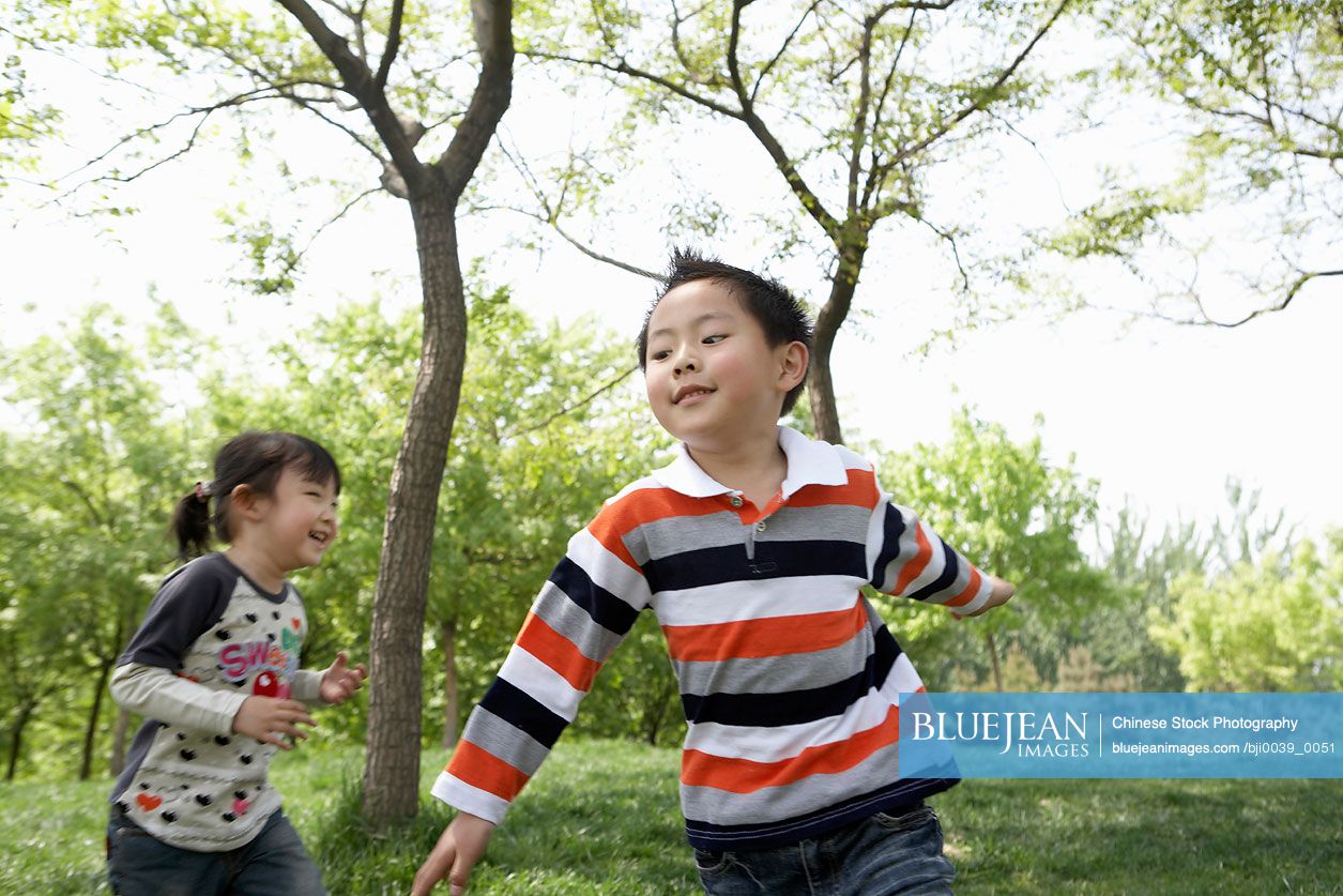 Chinese Children Playing Together In The Park