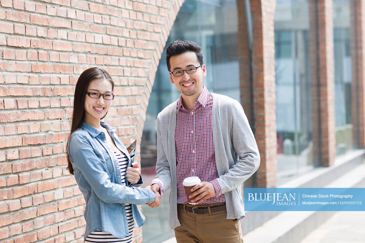 Chinese business partners shaking hands